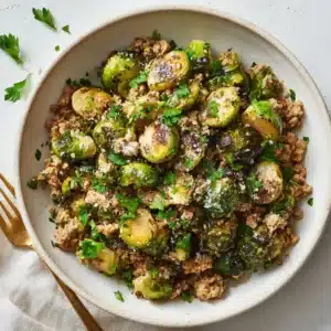A close-up overhead view of the savory ground turkey and brussels sprouts skillet, highlighting the caramelized vegetables and seasoned meat.