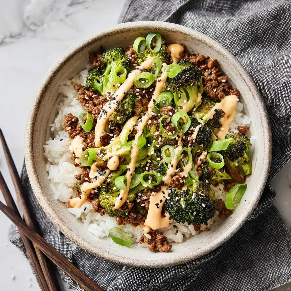 Ground Beef and Broccoli: A 20-Minute Weeknight Wonder 1 A bowl of ground beef and broccoli served over a bed of white rice, garnished with fresh green onions. An easy weeknight dinner.