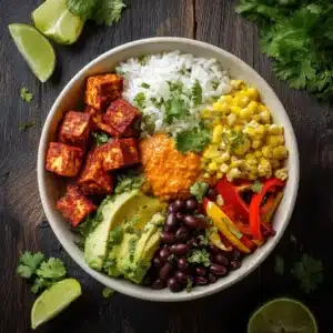 A close-up shot of a healthy vegan burrito bowl, showcasing the crispy texture of the spicy tofu and fresh ingredients.