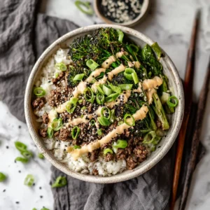 A skillet filled with the savory ground beef and broccoli stir fry, showing the glossy sauce coating every piece. A healthy ground beef recipe.