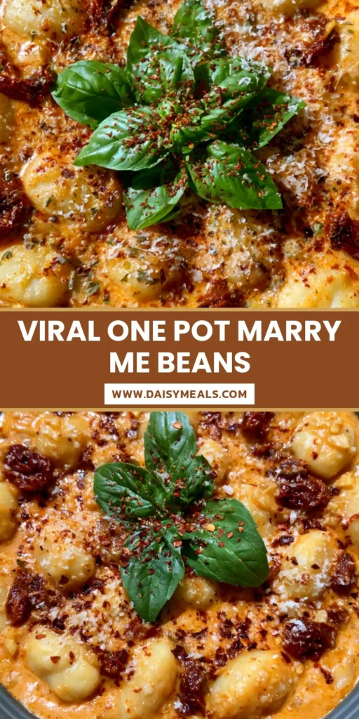 A close-up shot of creamy Marry Me Butter Beans in a dark bowl, garnished with fresh basil and red chili flakes.